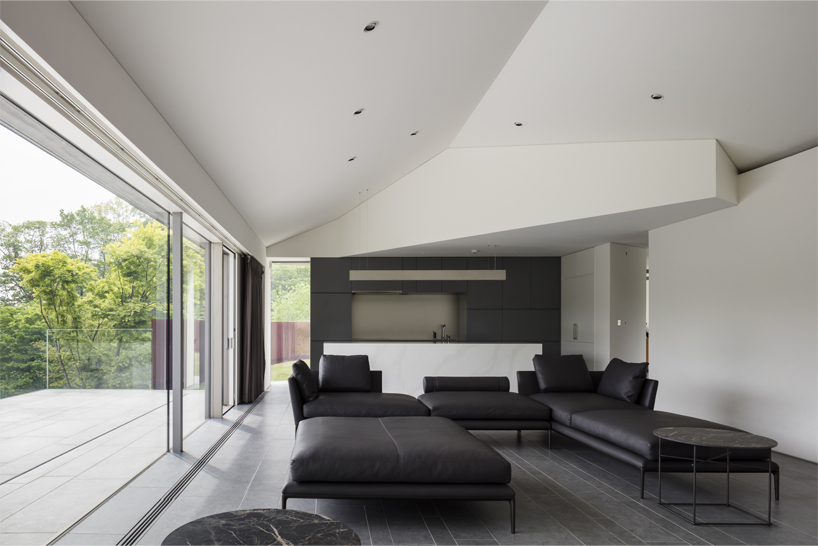 KIAS designs a cluster of concrete volumes for weekend house in japan designboom