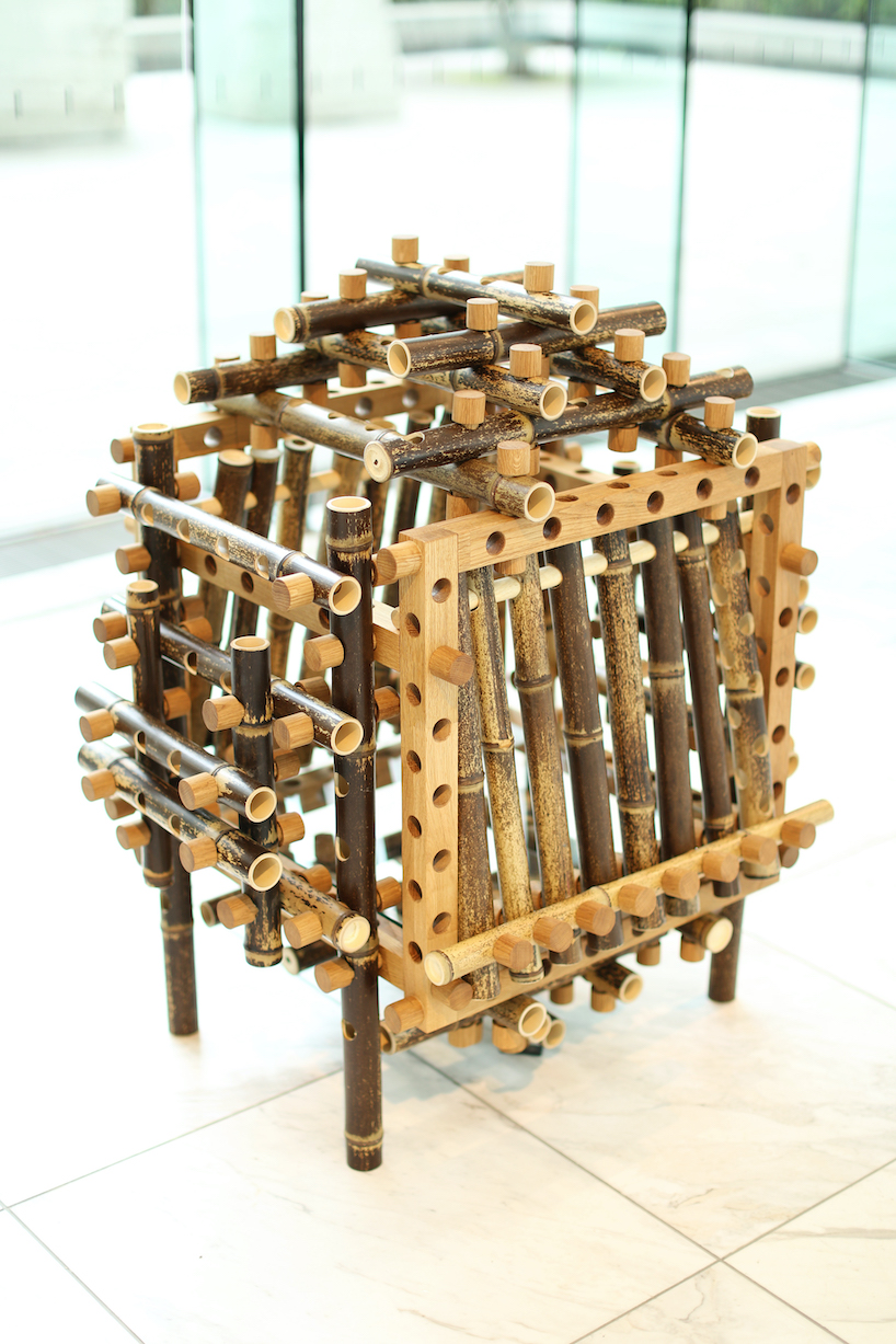 shigeki yamamoto builds intricate cabinet from japanese bamboo and german oak designboom