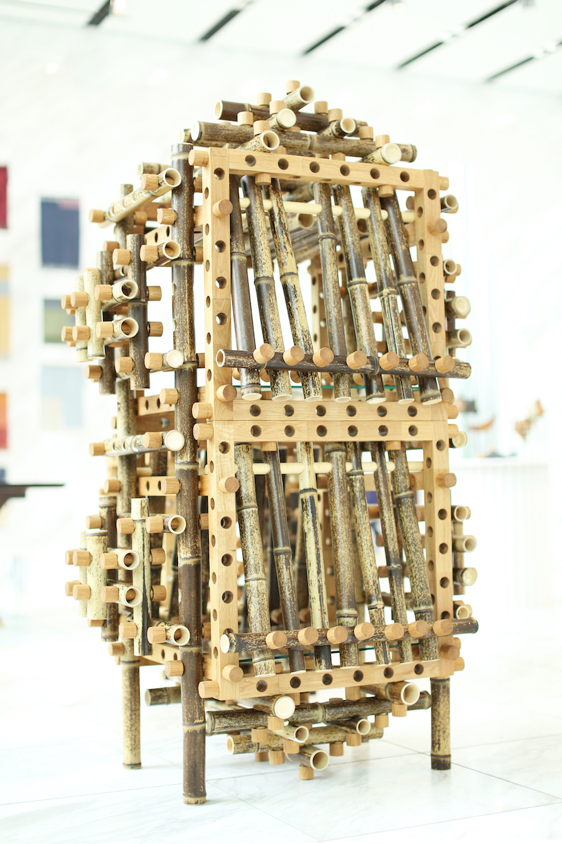shigeki yamamoto builds intricate cabinet from japanese bamboo and german oak designboom