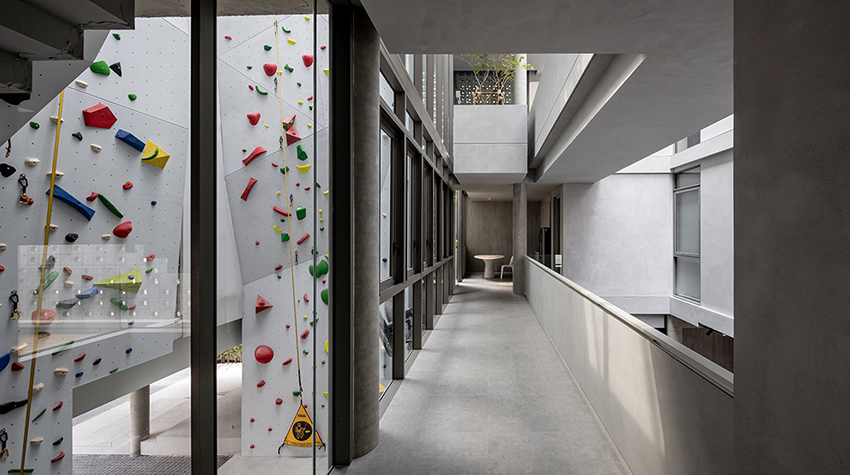 anonym studio creates house with brick façade and climbing wall in thailand