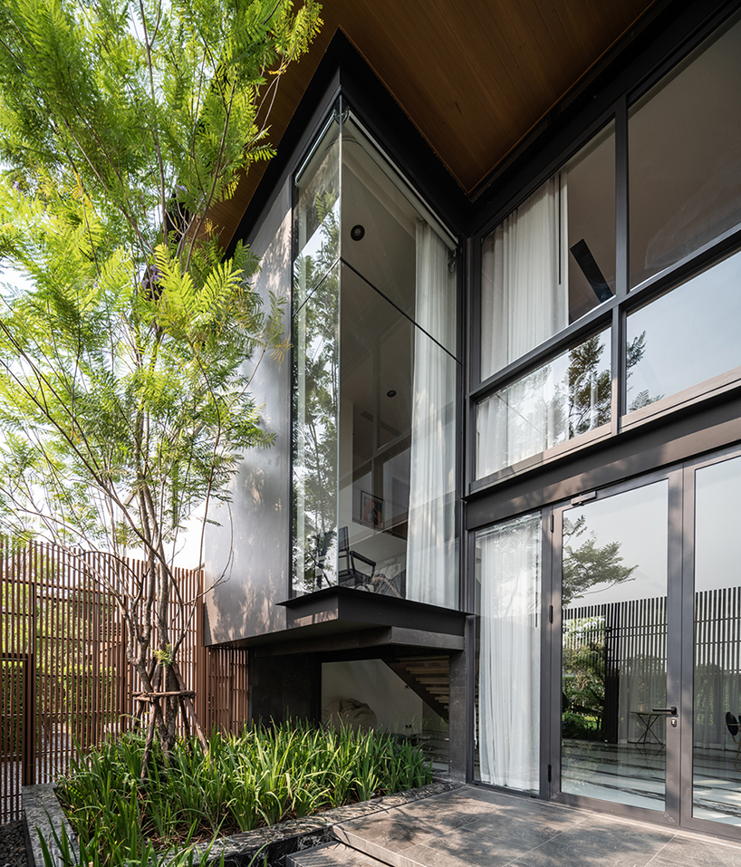 anonym studio builds a transparent and modern family house in thailand