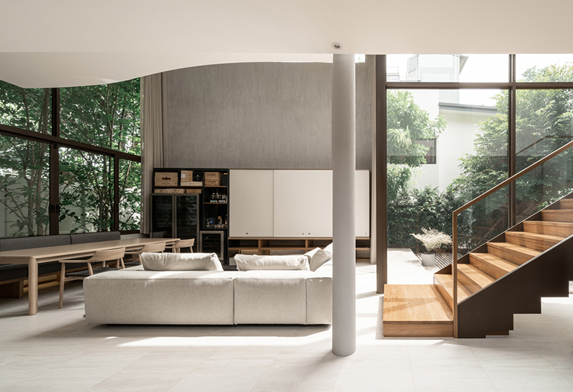 anonym studio stacks geometric rust and mortar volumes in tropical bangkok house