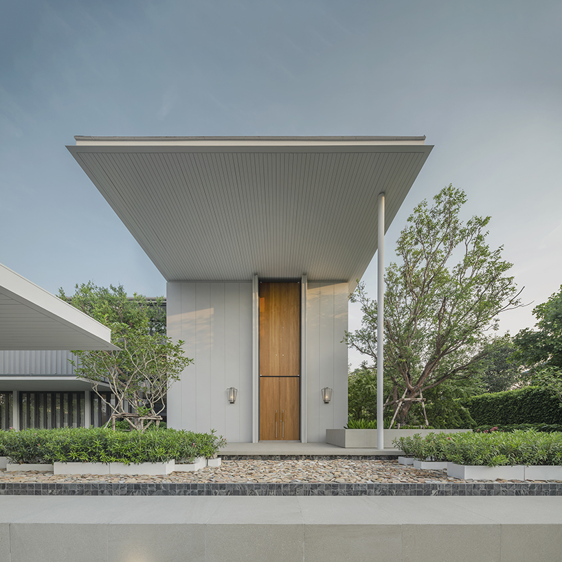 volumes, voids, and a warm ambience shape anonym studio's feng shui home in bangkok