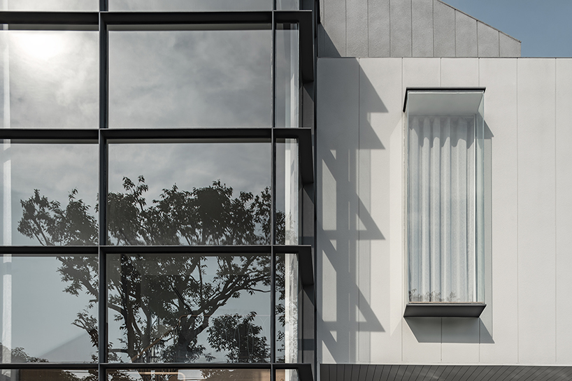 volumes, voids, and a warm ambience shape anonym studio's feng shui home in bangkok