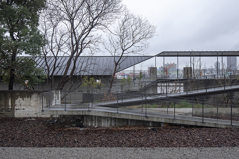 atelier deshaus transforms abandoned coal-unloading wharf into riverside passage in shanghai