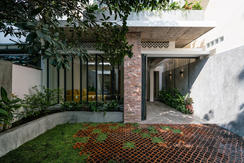 AD+studio renovates a saigon alley house with a roof referencing the shape of an umbrella