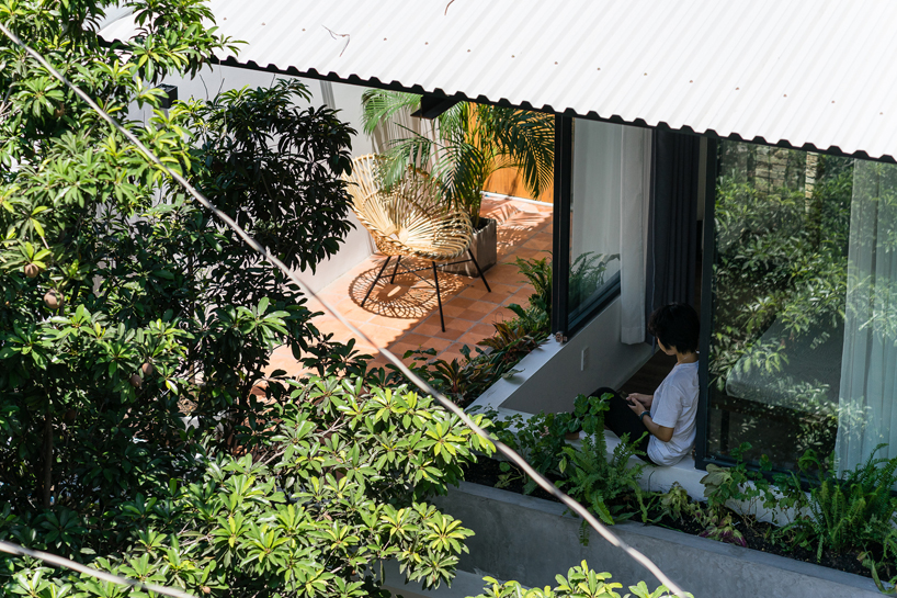 AD+ studio renovates a saigon alley house with a roof referencing the shape of an umbrella designboom