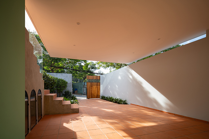 serpentine pink staircase highlights the inclination of AD+studio's house in vietnam