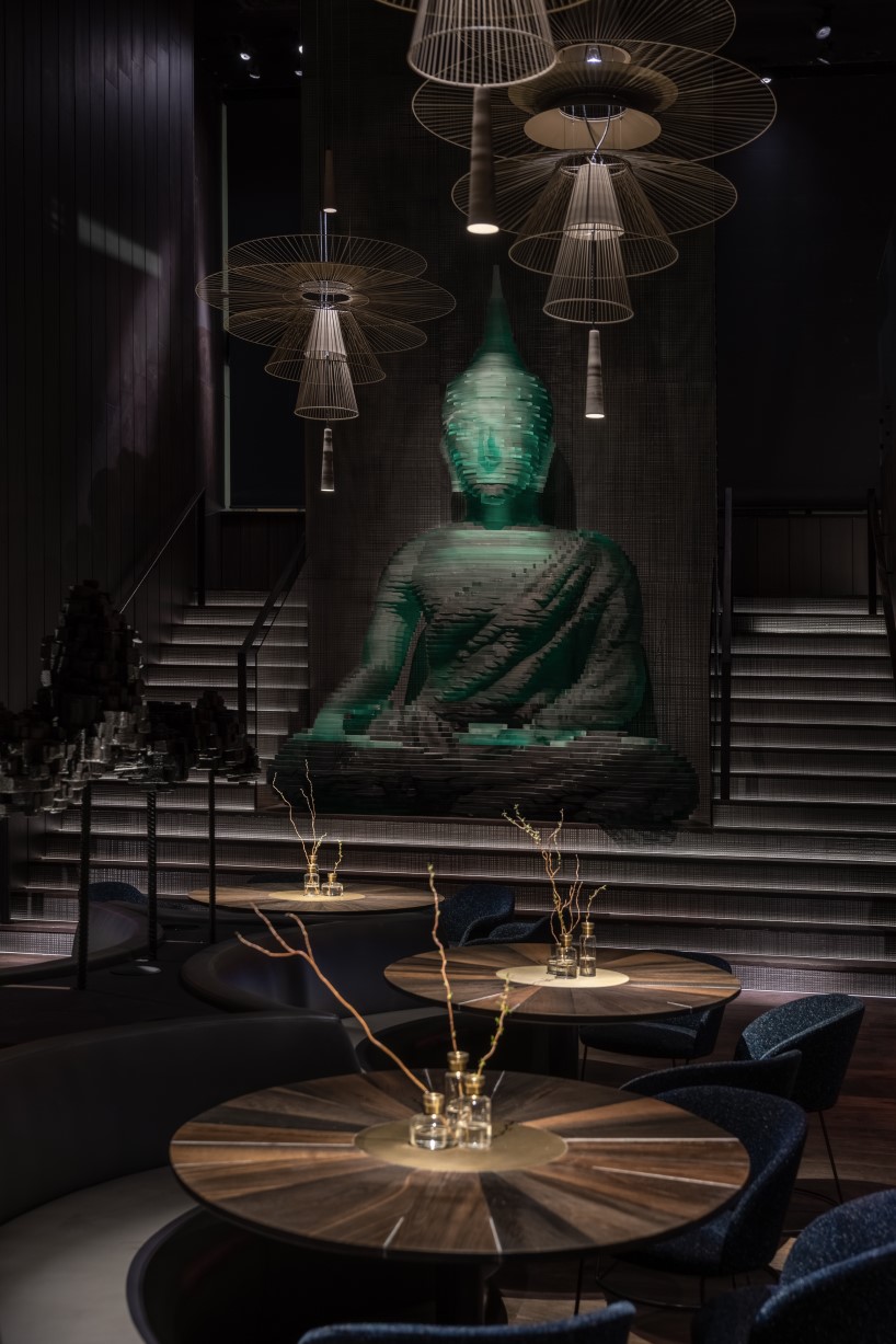 YOD group decorates new york restaurant interior with 4.5-meter-tall  glass-hewn buddha sculpture