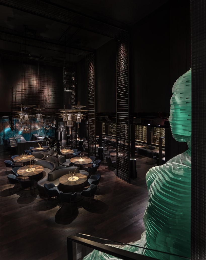 4.5-meter-tall glass-hewn buddha sculpture decorates restaurant interior by YOD group in new york