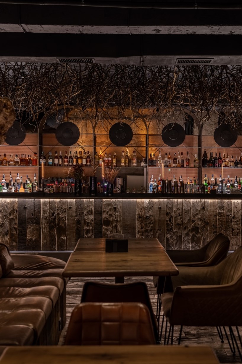 yod group designed a bar with roots on the ceiling that locates under the flower shop 4