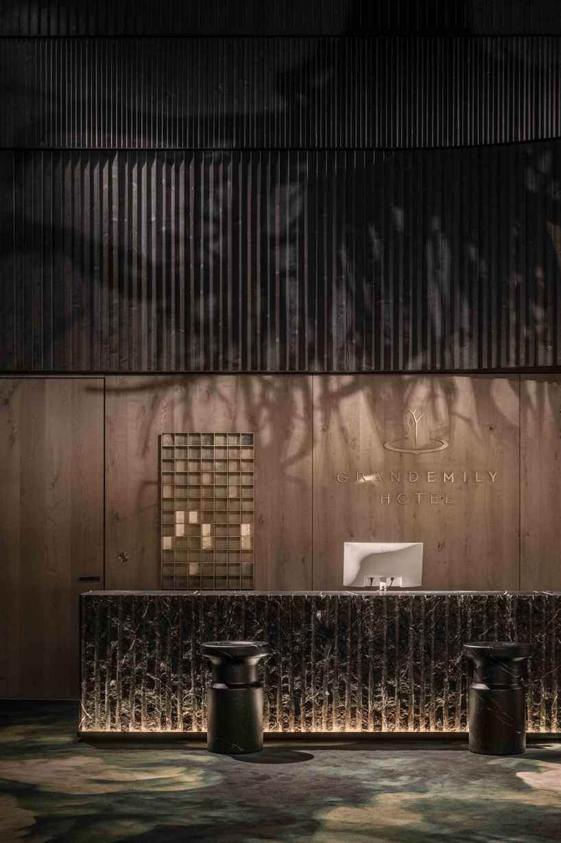 YOD group suspends sycamore tree installation to illuminate grand hotel atrium in ukraine