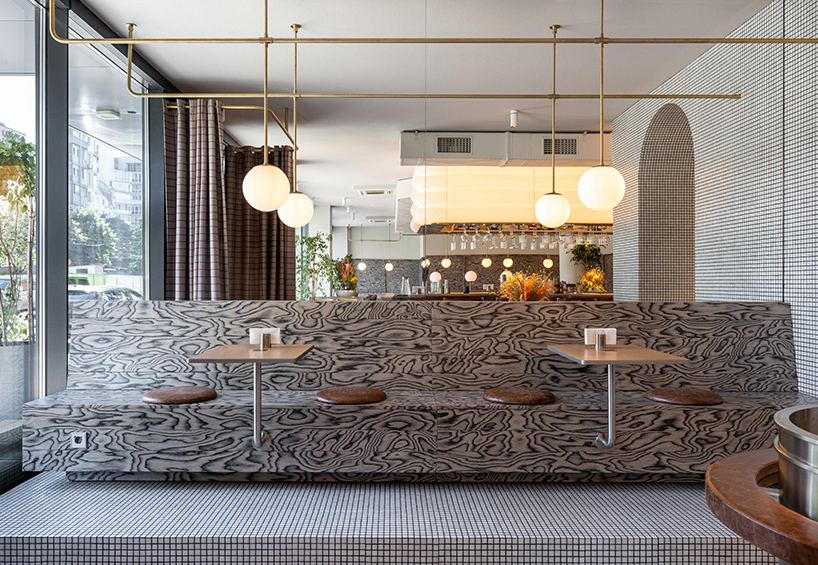 mosaics, check patterns, and textured veneers clad YOD group's modern italy-inspired bistro