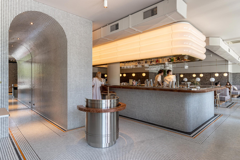 mosaics, check patterns, and textured veneers clad YOD group's modern italy-inspired bistro