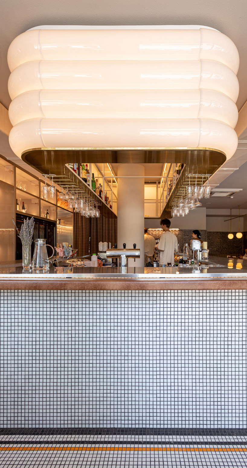 mosaics, check patterns, and textured veneers clad YOD group's modern italy-inspired bistro