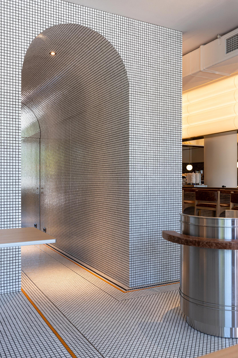 mosaics, check patterns, and textured veneers clad YOD group's modern italy-inspired bistro