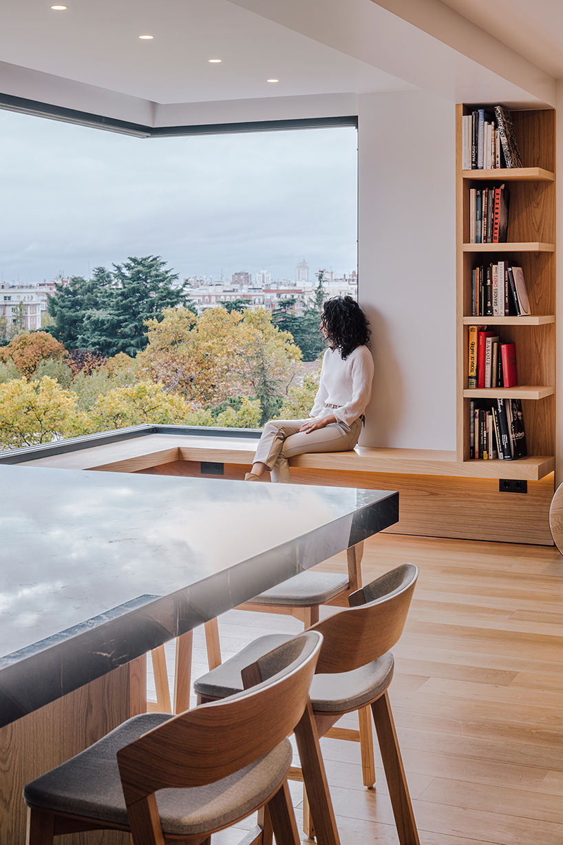 large transparent corner in zooco estudio's casa paco opens towards madrid's skyline