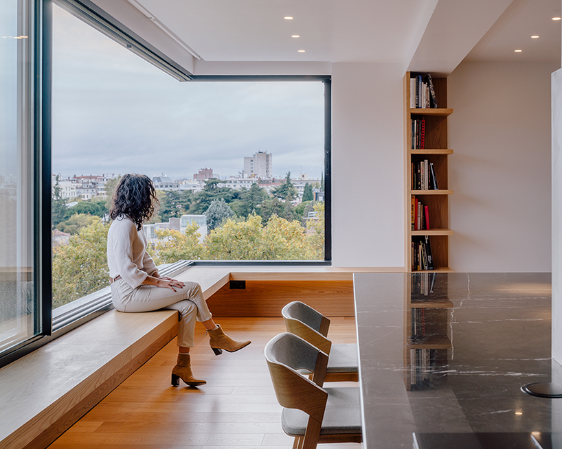 large transparent corner in zooco estudio's casa paco opens towards madrid's skyline