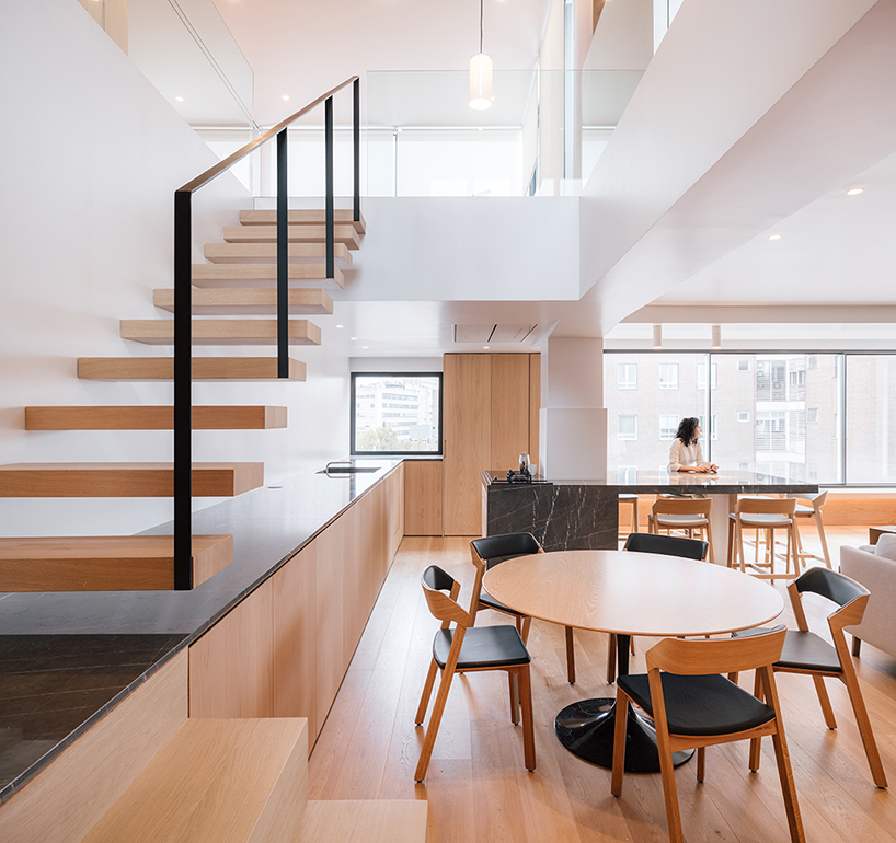 large transparent corner in zooco estudio's casa paco opens towards madrid's skyline