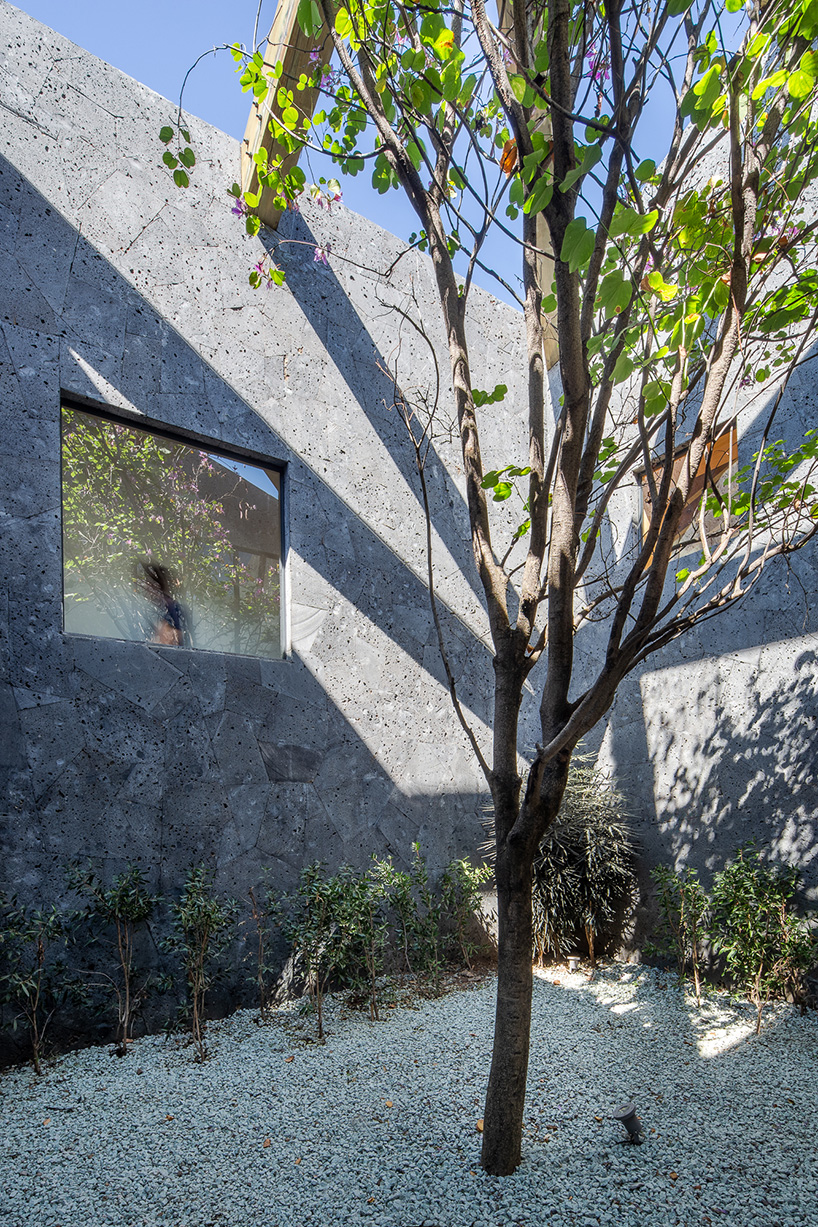 HGR arquitectos uses stone clad volumes to form 'casa texcal' within mexican countryside