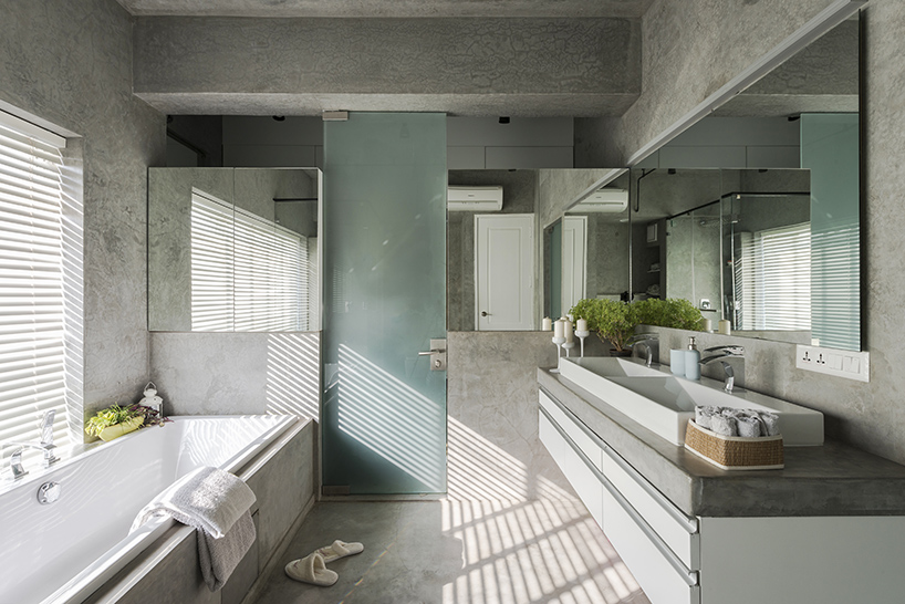 harsh boghani exposes raw materials and adds bold sculpture to apartment in india - 8