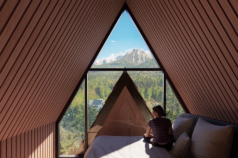 studio beltrame tucks pine-shaped treehouse high amid the forestscape of the italian alps