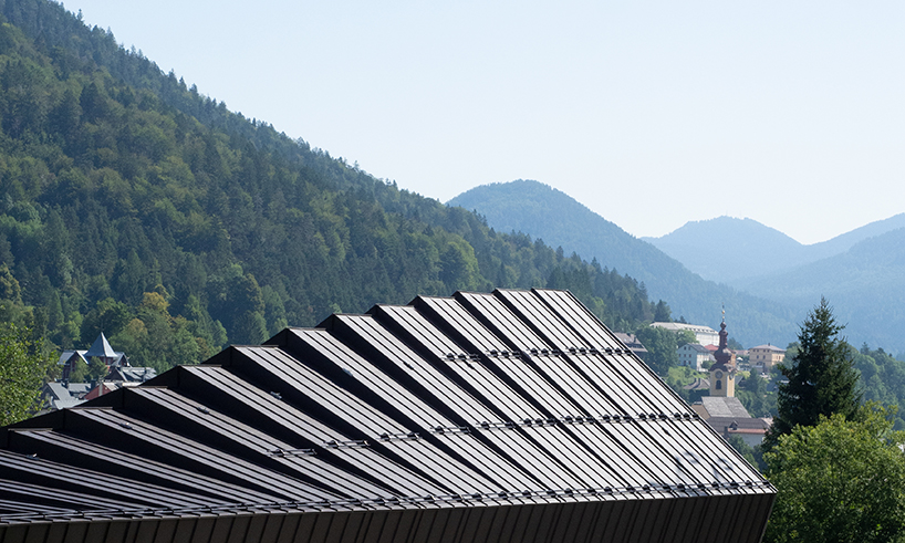 undulating tiered rafter by studio beltrame envelops ski school in italy