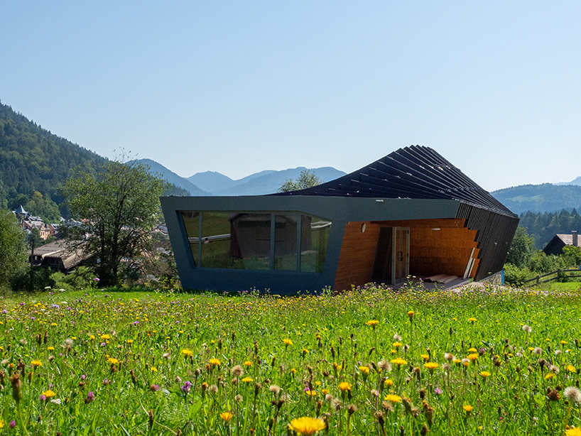 undulating tiered rafter by studio beltrame envelops ski school in italy