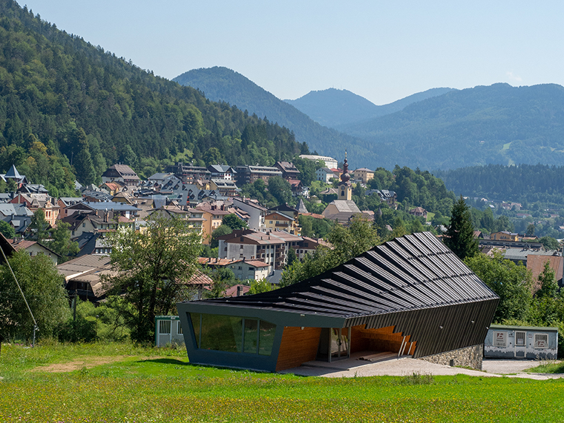undulating tiered rafter by studio beltrame envelops ski school in italy