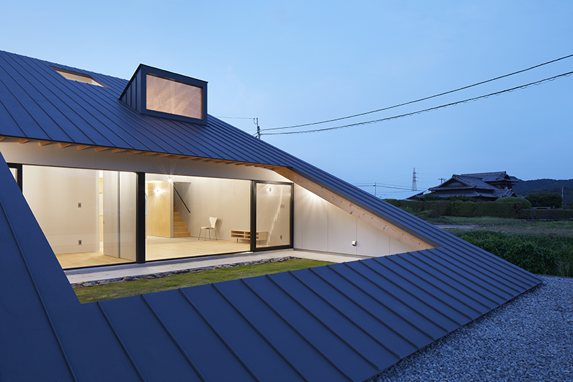 kenta eta's 'house usuki' in japan has sloped roof you can sit on and admire the view