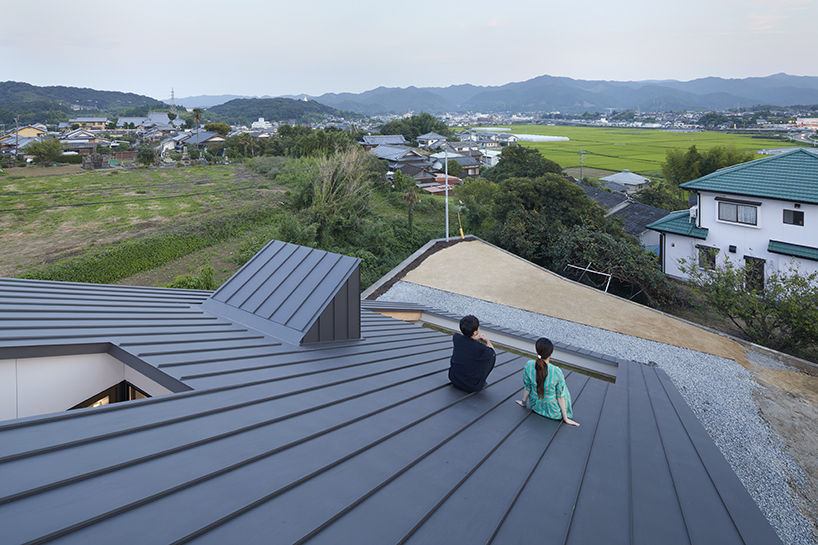 kenta eta's 'house usuki' in japan has sloped roof you can sit on and admire the view