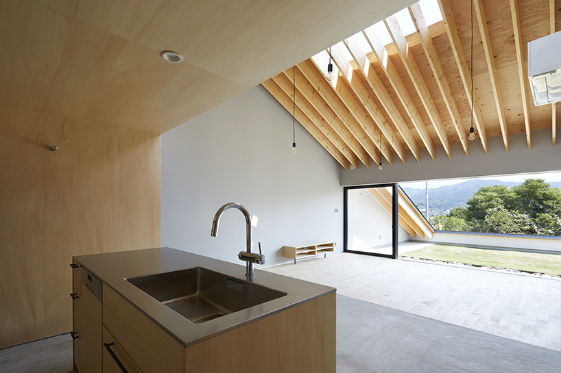 kenta eta's 'house usuki' in japan has sloped roof you can sit on and admire the view