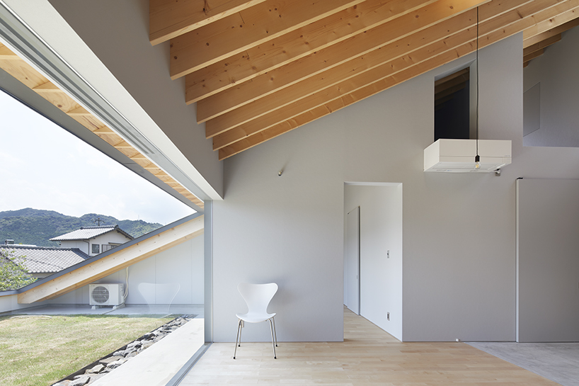 kenta eta's 'house usuki' in japan has sloped roof you can sit on and admire the view