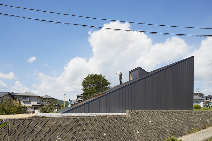 kenta eta's 'house usuki' in japan has sloped roof you can sit on and admire the view