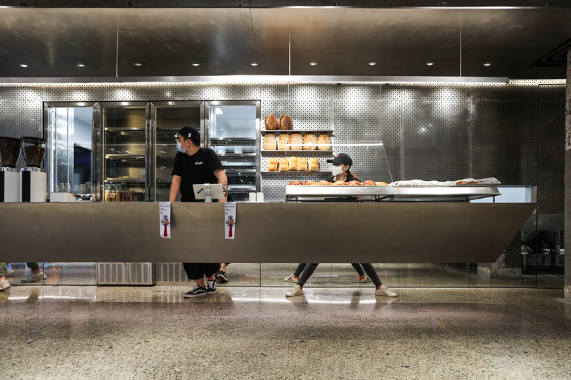 steel counters, concrete walls + metal curtain partitions realize 'basdban' café in shanghai