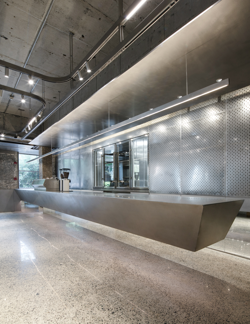 steel counters, concrete walls + metal curtain partitions realize 'basdban' café in shanghai