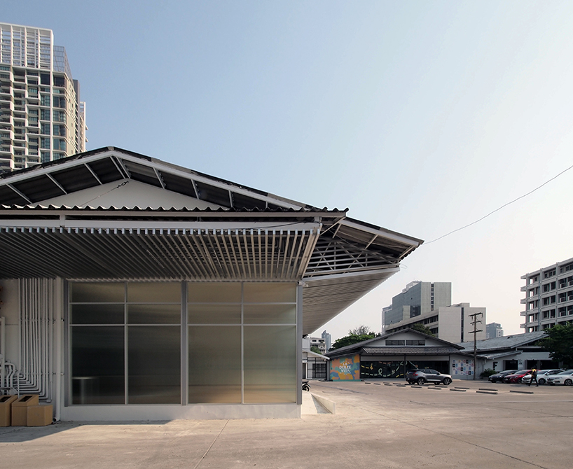 ASWA uses rippled glazing to convert a former warehouse into a new office in bangkok designboom