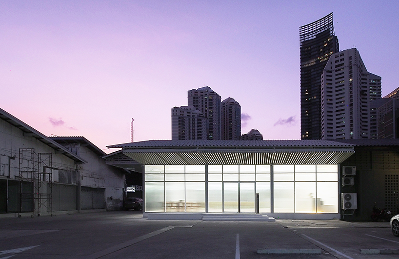 ASWA uses rippled glazing to convert a former warehouse into a new office in bangkok designboom