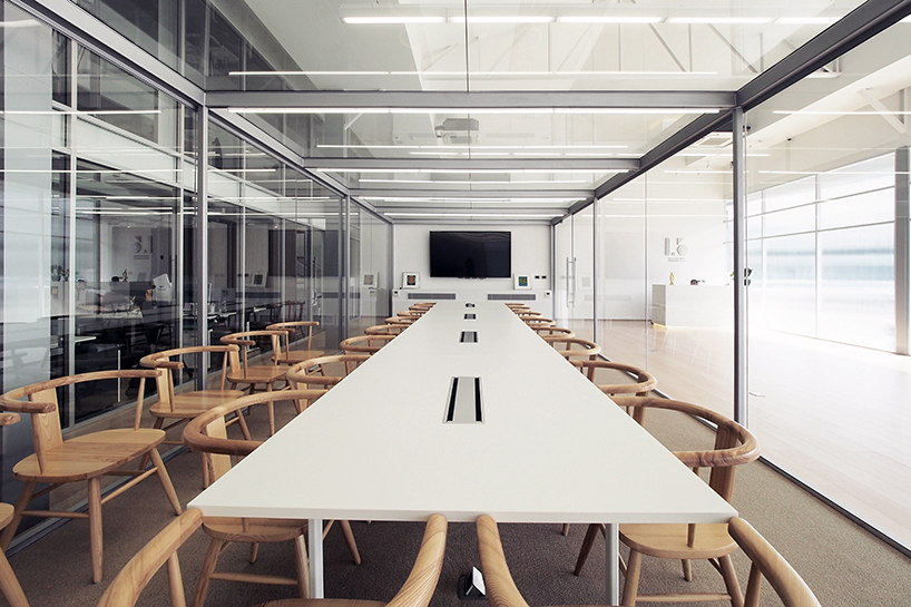 ASWA uses rippled glazing to convert a former warehouse into a new office in bangkok designboom