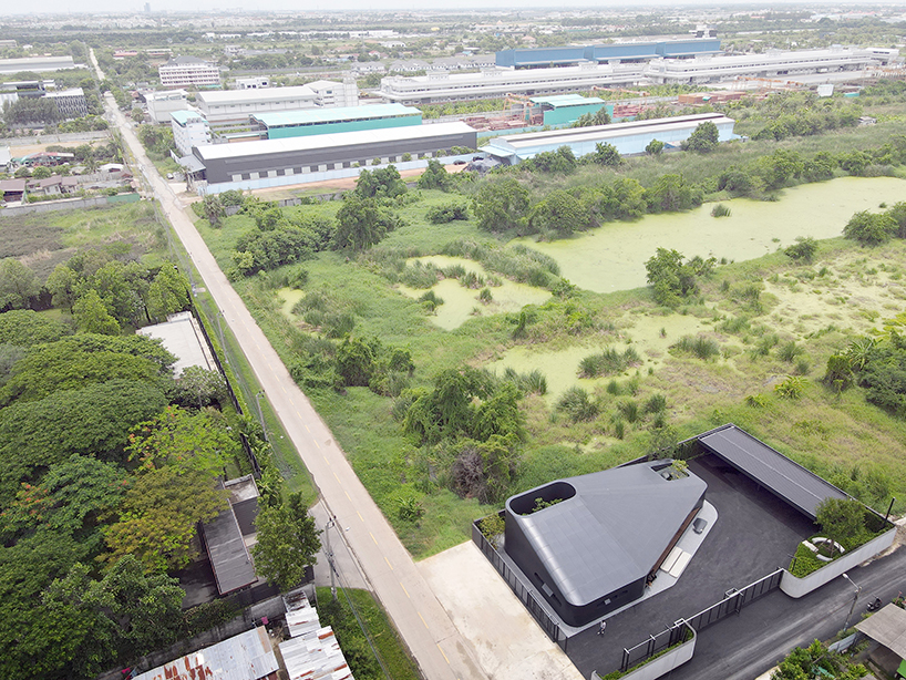 ASWA wraps office into metallic black aluminum mimicking the brand's packaging products