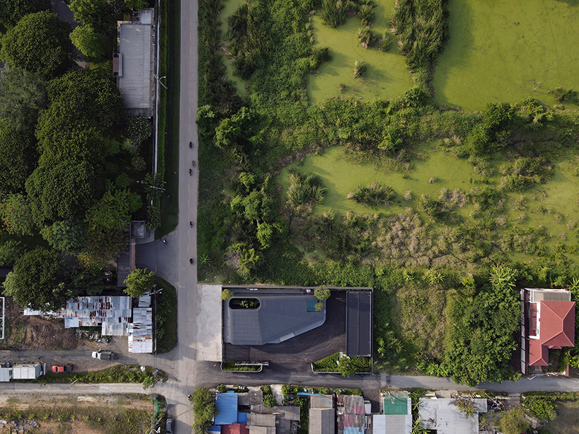 ASWA wraps office into metallic black aluminum mimicking the brand's packaging products