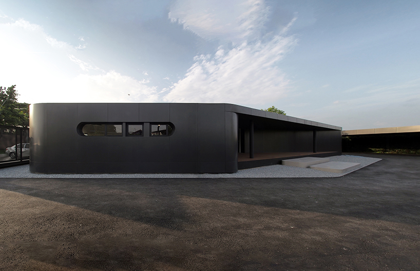 ASWA wraps office into metallic black aluminum mimicking the brand's packaging products