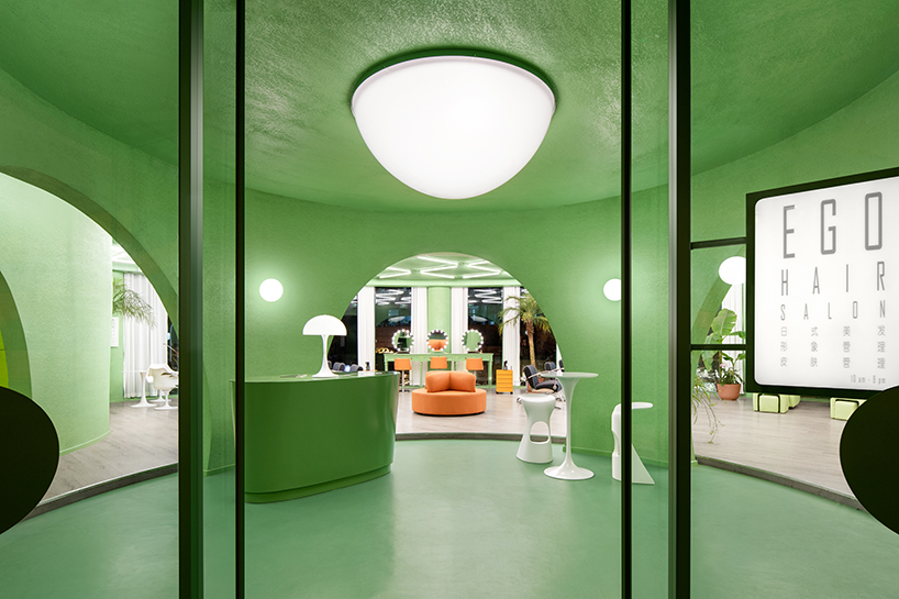 Form design idea #244: bright green walls and organic shapes form ‘space age’ style hair salon in beijing