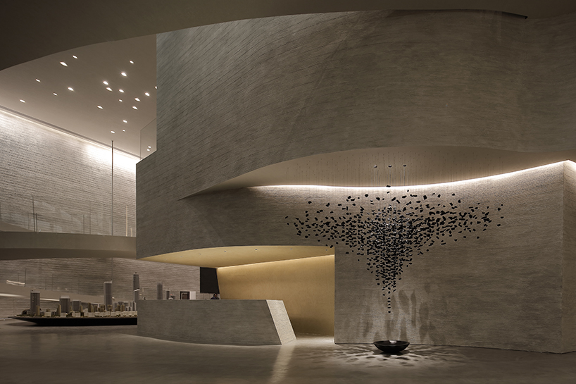 waterfrom design forms sweeping organic curves for art space in china