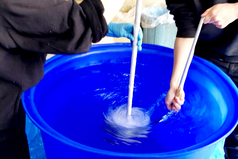 we+ captures the shape of a water vortex to create the 'swirl' light fixture designboom