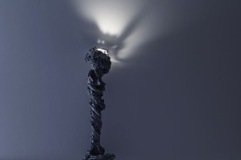we+ captures the shape of a water vortex to create the 'swirl' light fixture designboom