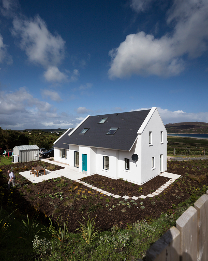 DUA completes cladach house with simple interiors and deep pitched roof in ireland