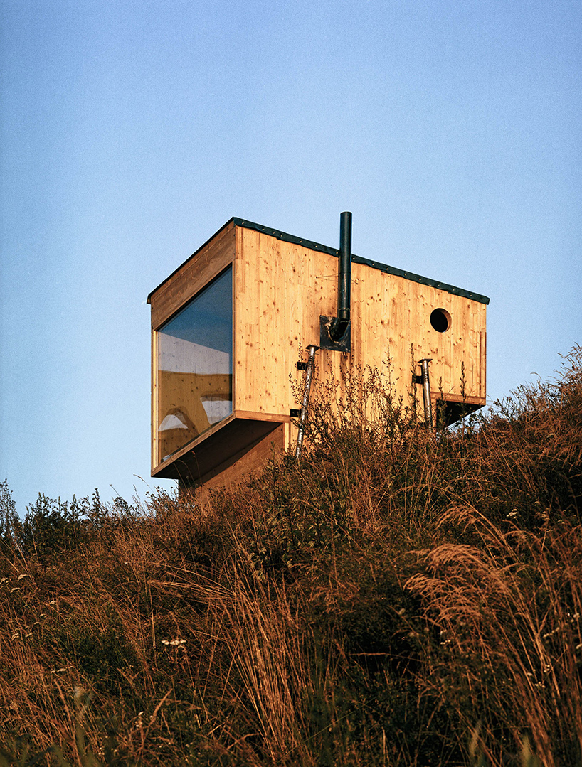 mobile sauna by BIVAK perches on recycled wooden stilts for an exclusive retreat