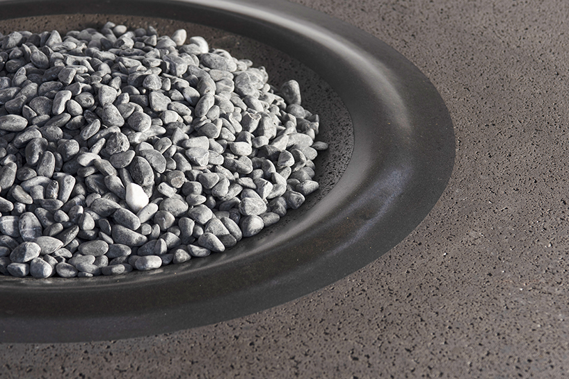 peca studio introduces 'umo rocka' sculptural fire pit made out of volcanic rock