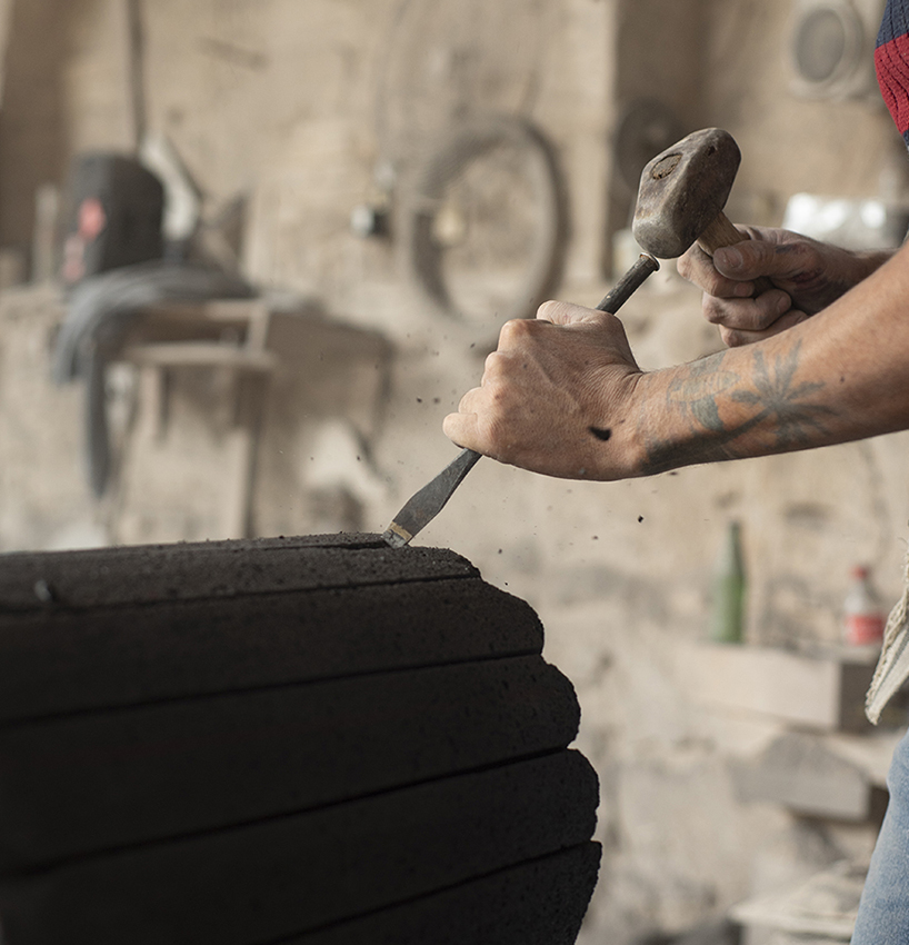 peca studio carves tables from volcanic rock for 'loto roca' collection designboom